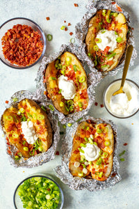 These Crock Pot Baked Potatoes are WAY easier to make than oven baked – load them up with bacon, cheese, sour cream and chives for a full meal!  Jump to Recipe