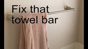Bathroom towel bar fixing it to the wall